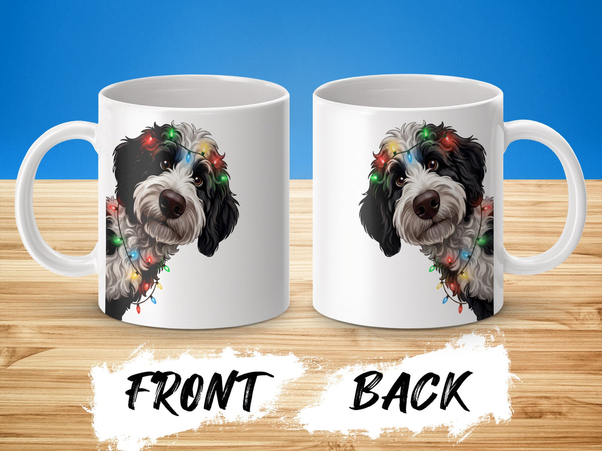 White mugs with a black and white dog wearing colorful holiday lights. Front and back views shown.
