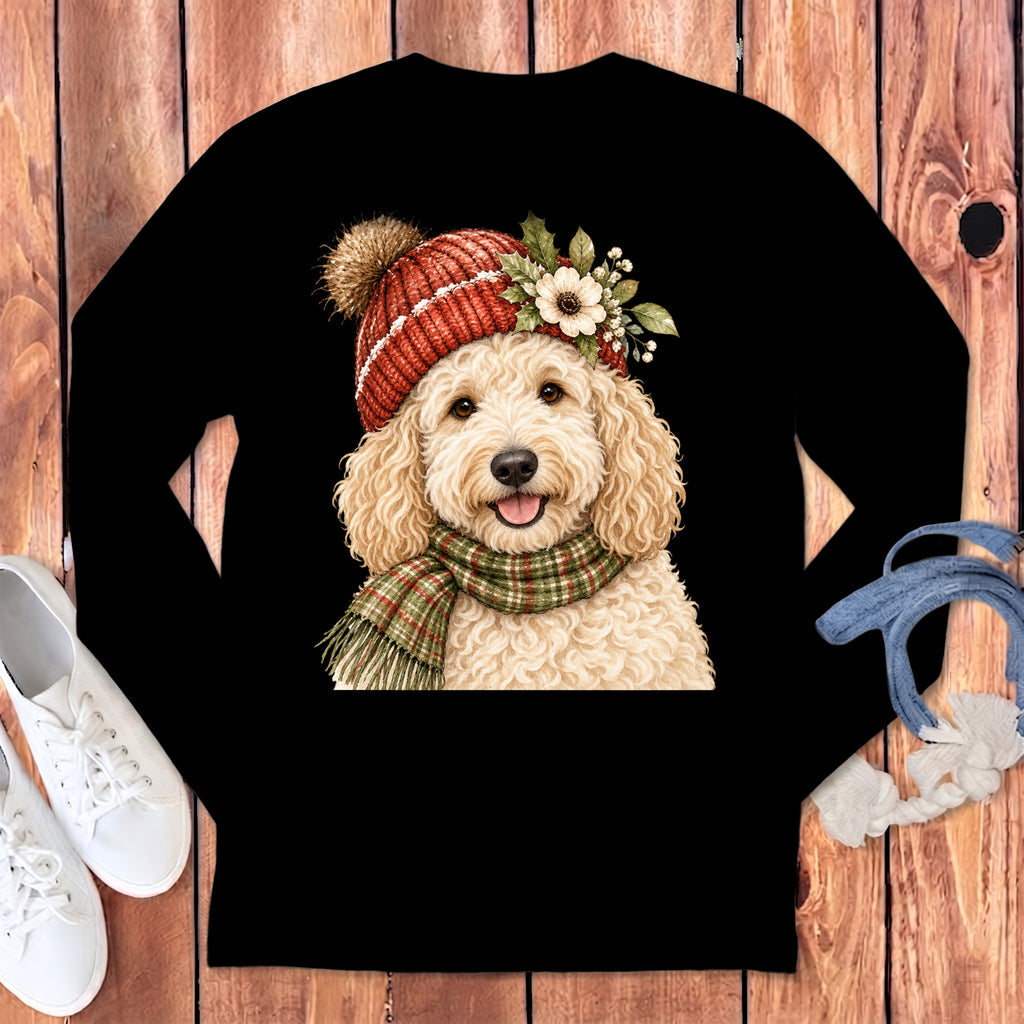 Goldendoodle wearing a red knit hat and plaid scarf with floral accents.