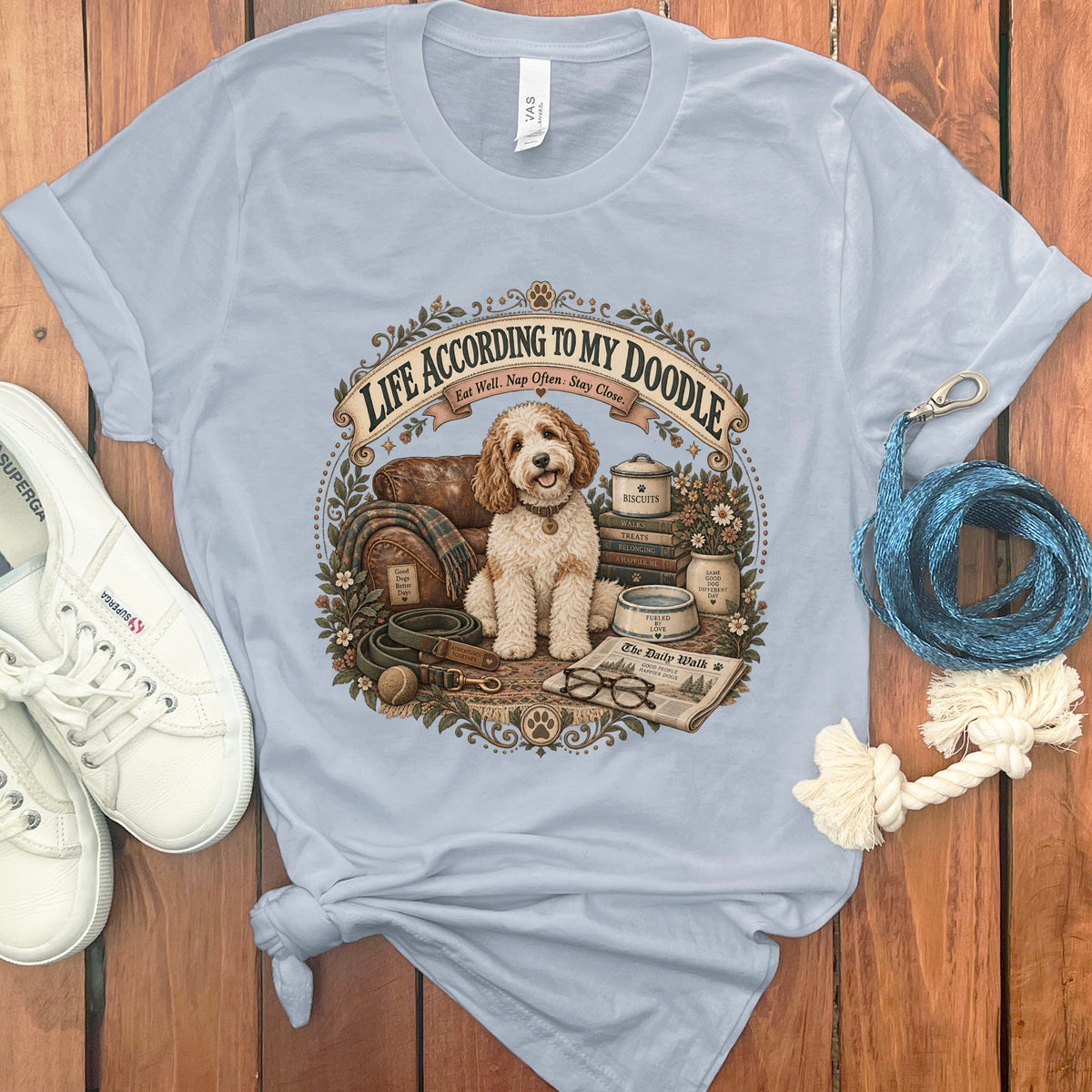 Light blue t-shirt with "Life According to My Doodle" graphic and a fluffy dog.