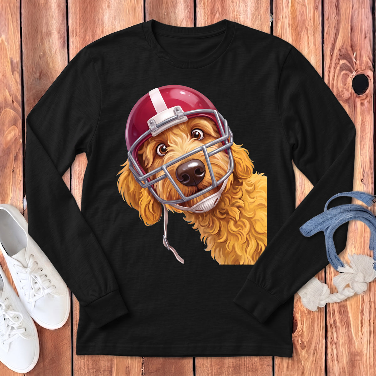 Golden doodle dog wearing a red and white football helmet on a black shirt.