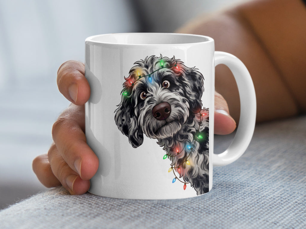 White mug with dog illustration wearing Christmas lights.
