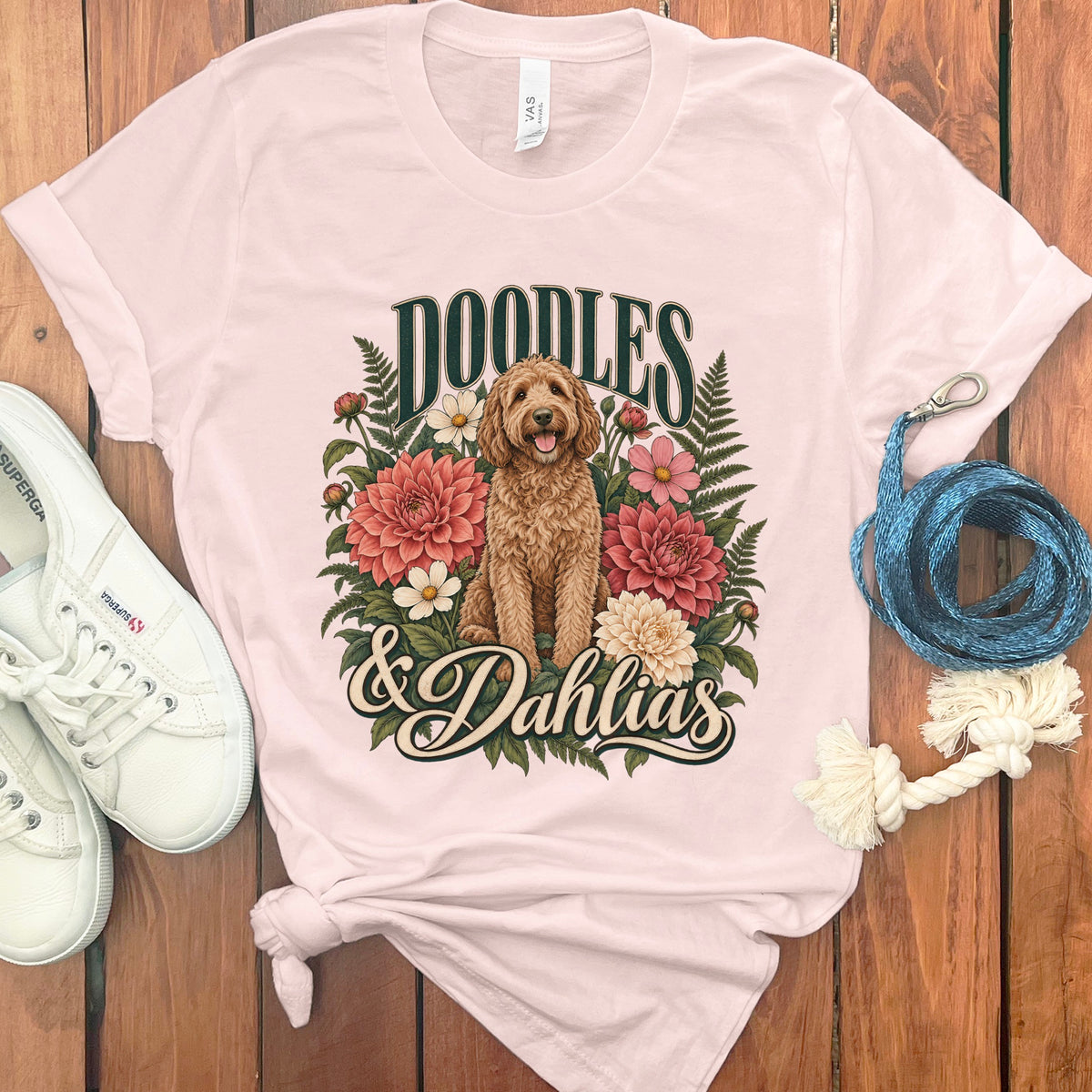 Light pink t-shirt with "Doodles & Dahlias" text and doodle dog illustration.