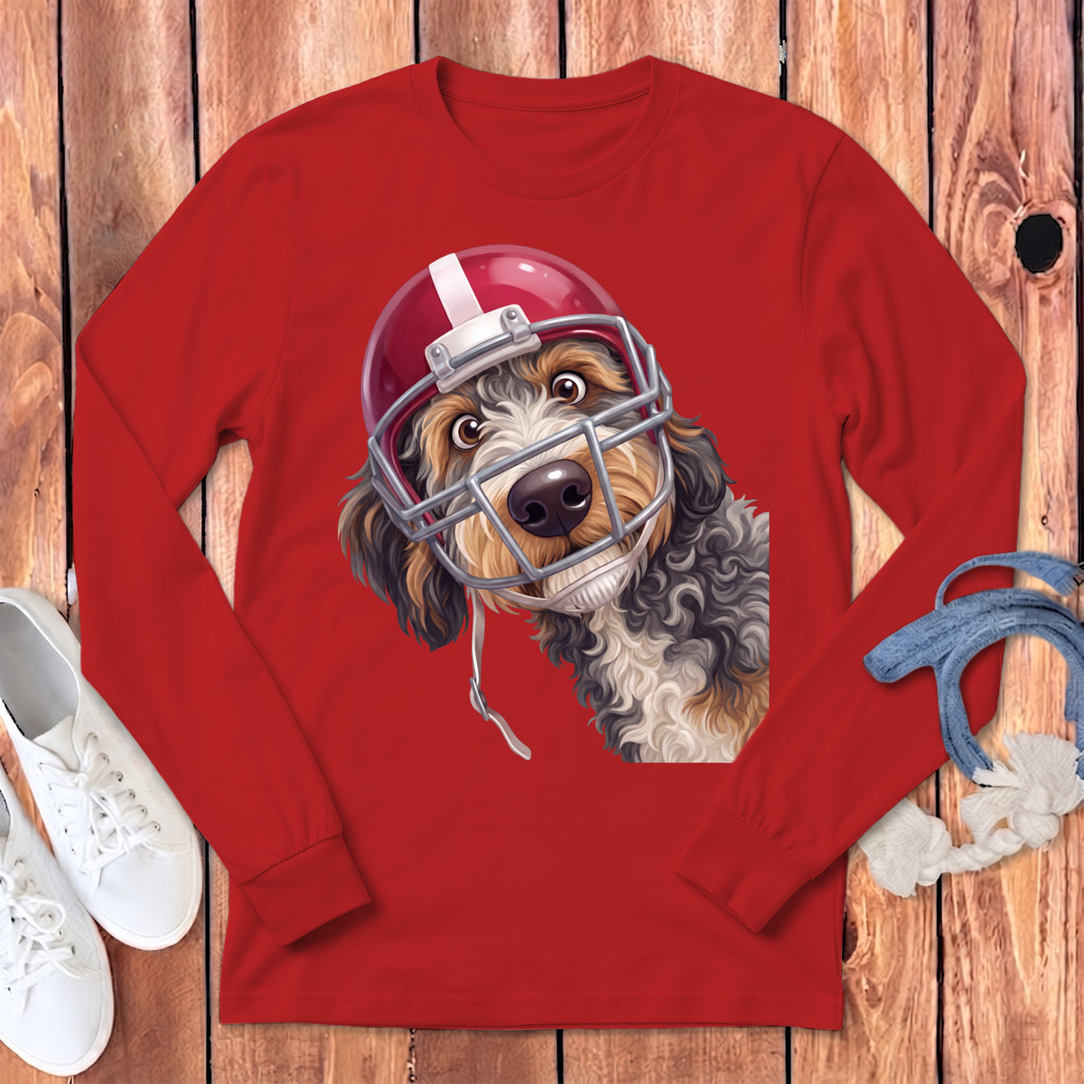 Red long-sleeve shirt with a dog wearing a football helmet graphic.