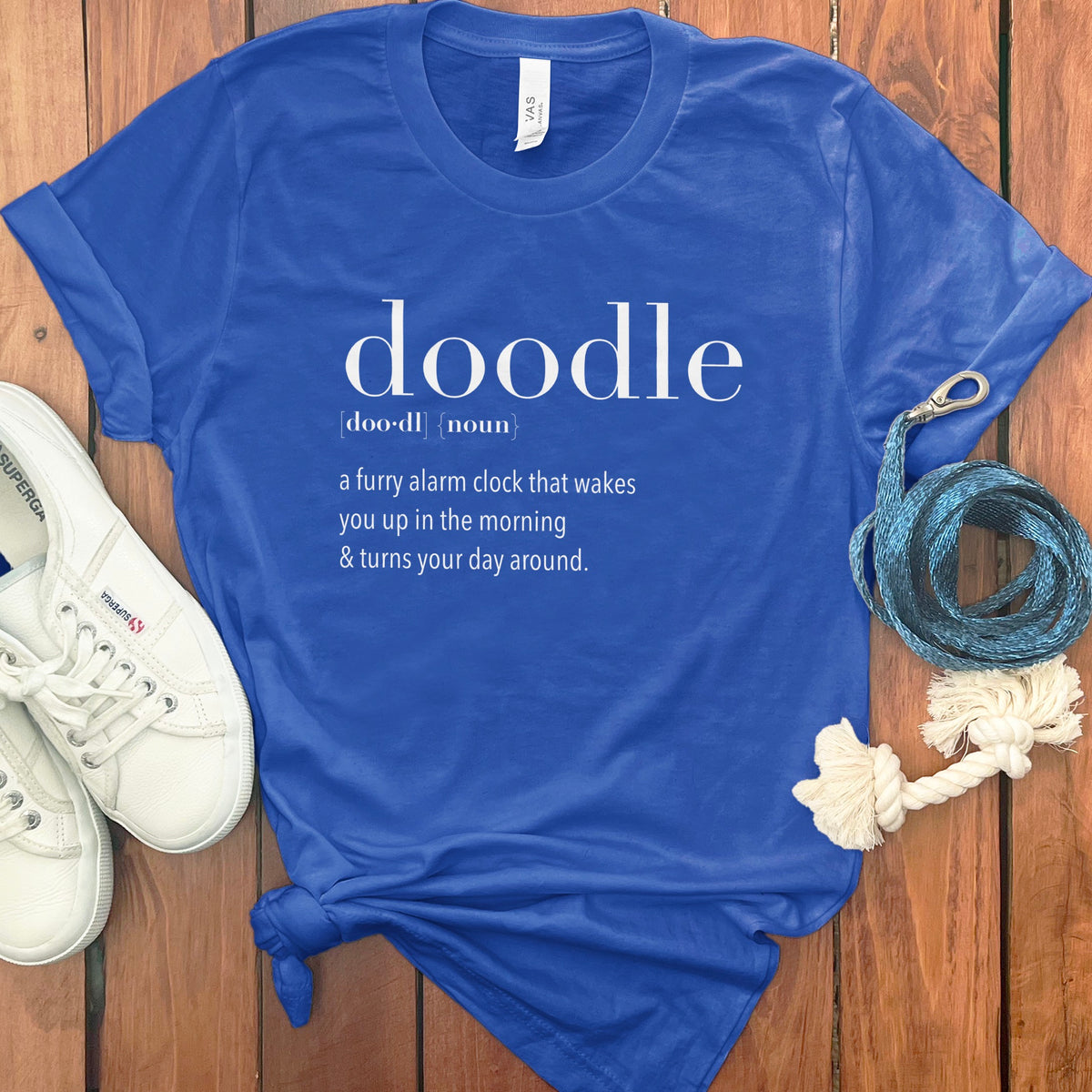 Blue t-shirt with "doodle" definition: "a furry alarm clock that wakes you up".