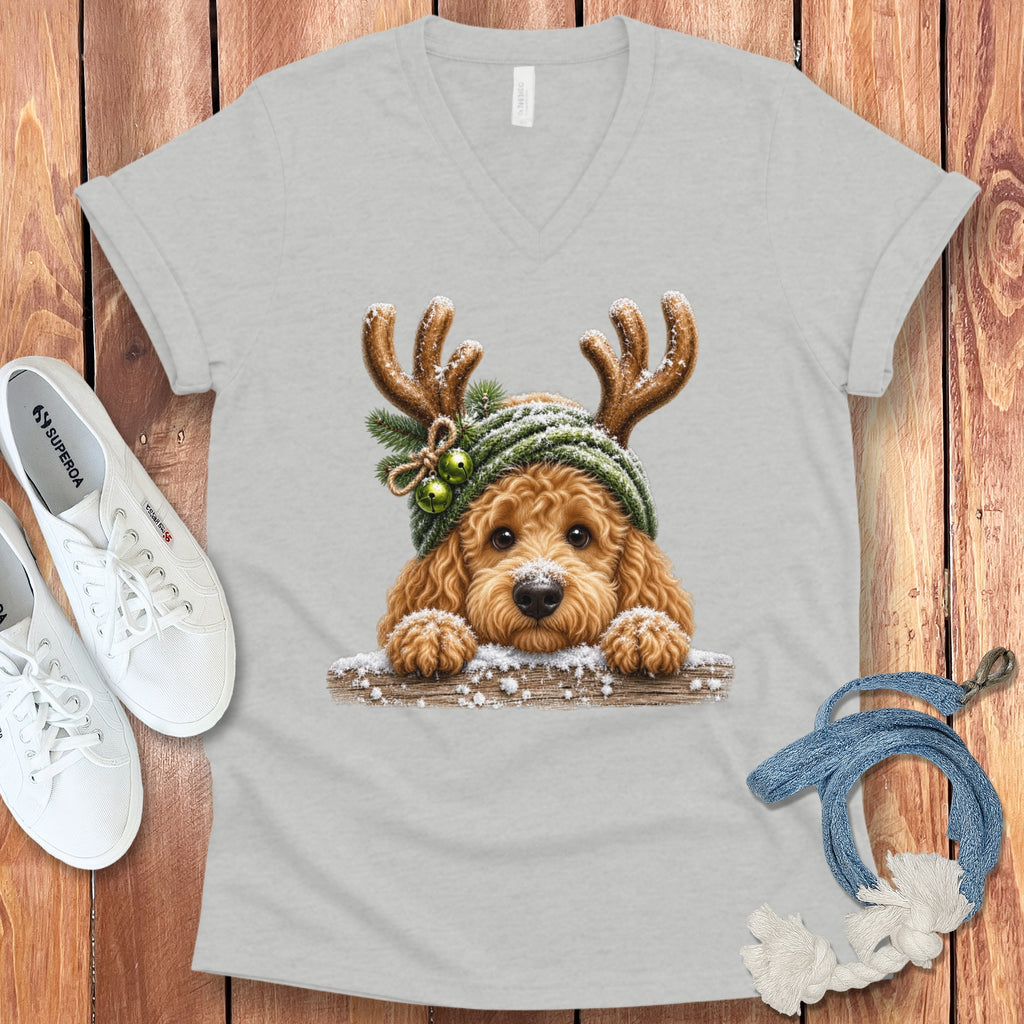 Light grey v-neck t-shirt with a fluffy dog wearing reindeer antlers and a knit hat.