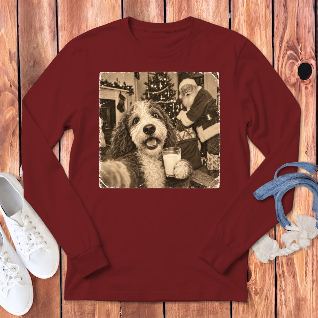Maroon long-sleeve crewneck t-shirt featuring a vintage sepia graphic of a dog holding a glass of milk with Santa Claus in the background.
