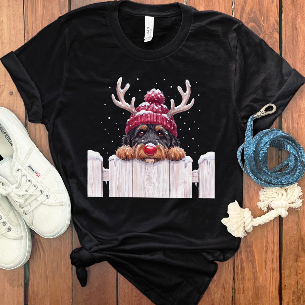 Black t-shirt with a watercolor dog wearing a red beanie and reindeer antlers.