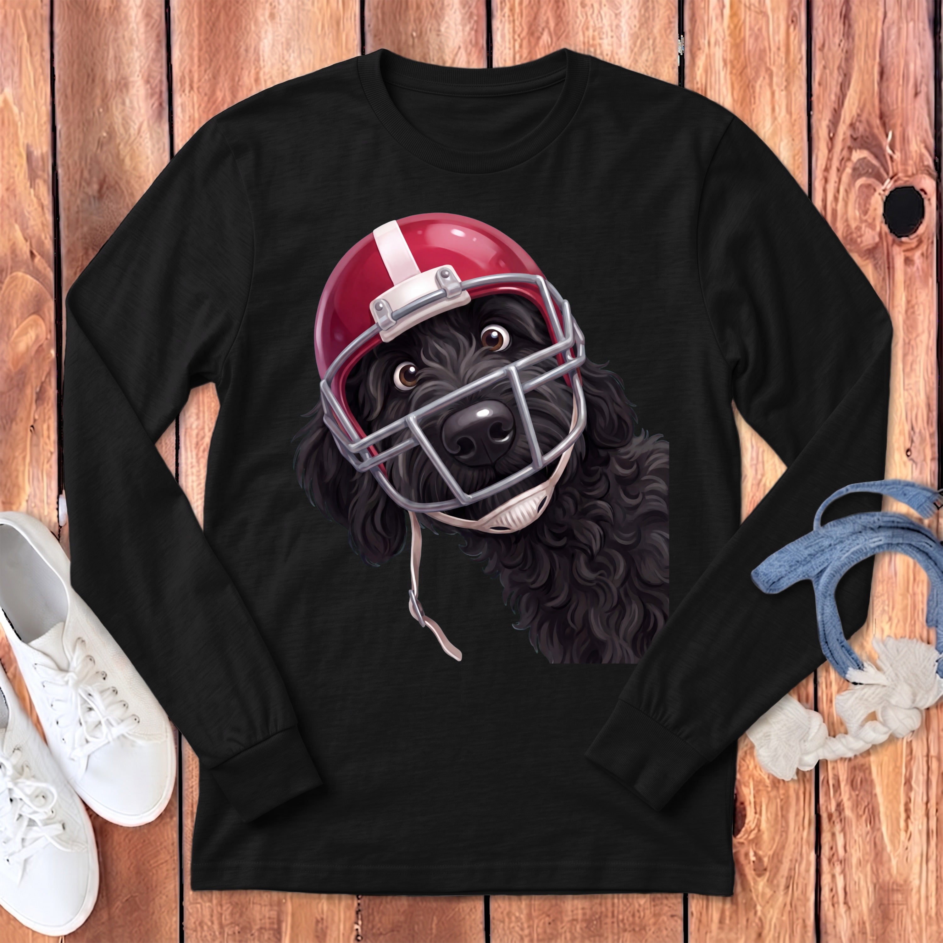 Black long-sleeve shirt with a black doodle dog wearing a red football helmet.