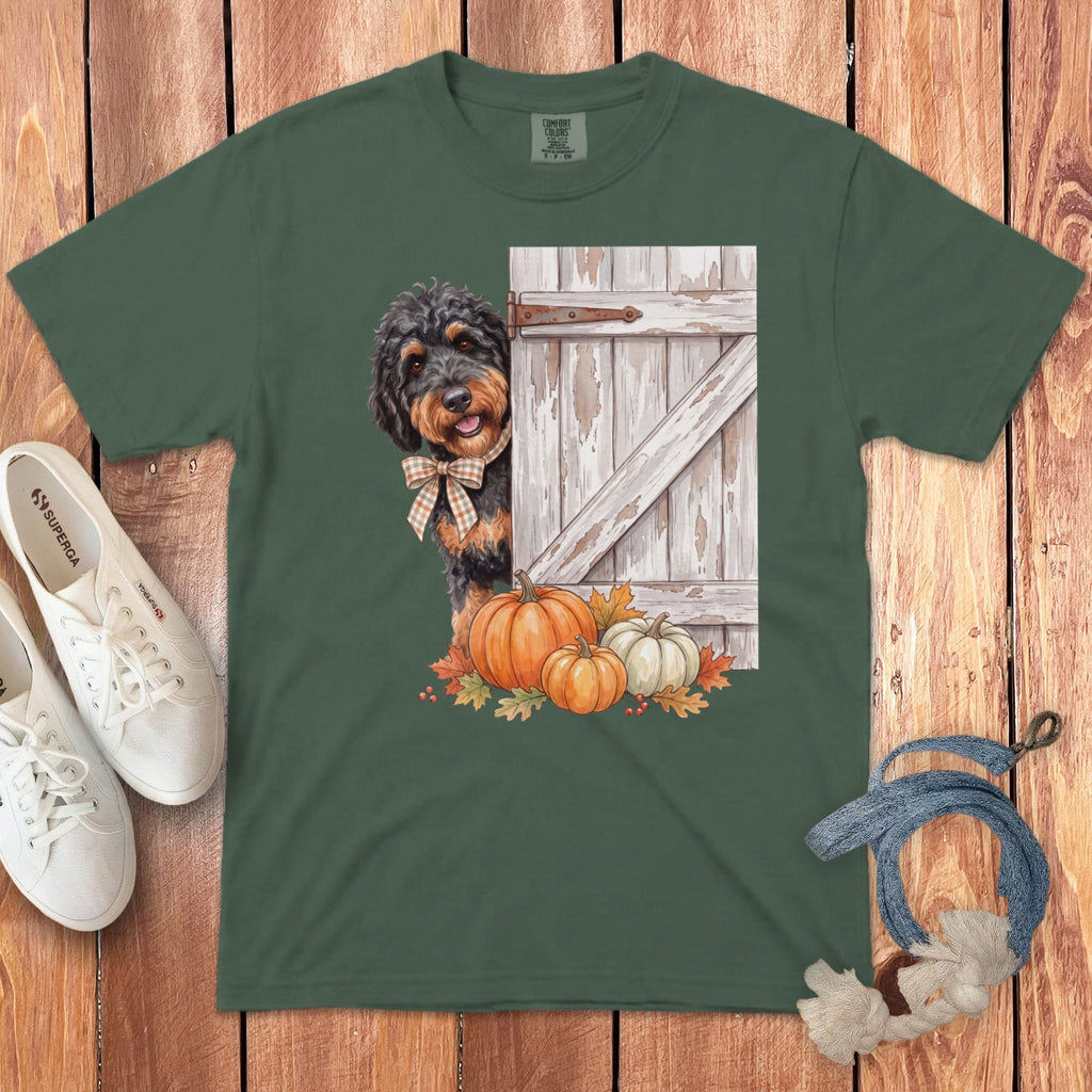 Green t-shirt with dog, pumpkins, and rustic barn door graphic.
