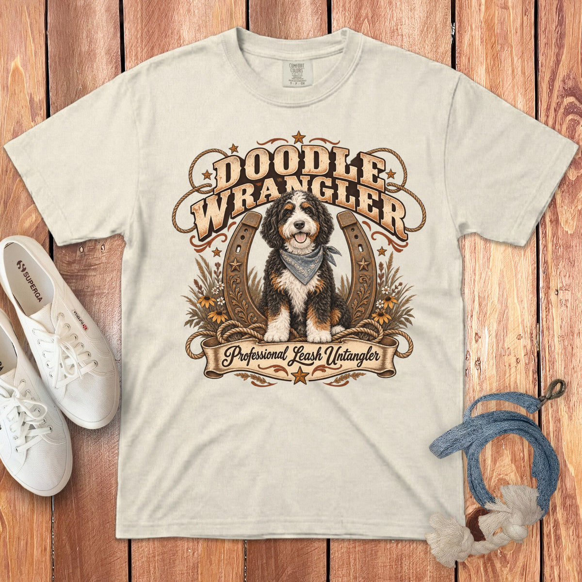 Bernese Mountain Dog graphic on cream t-shirt with text "Doodle Wrangler Professional Leash Untangler."