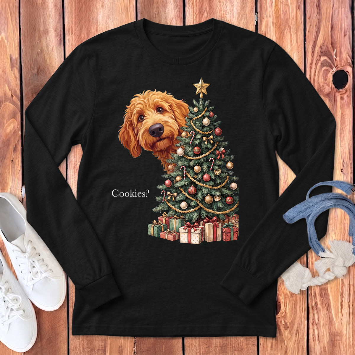 Golden doodle peeking from behind a Christmas tree with gifts and the text "Cookies?".