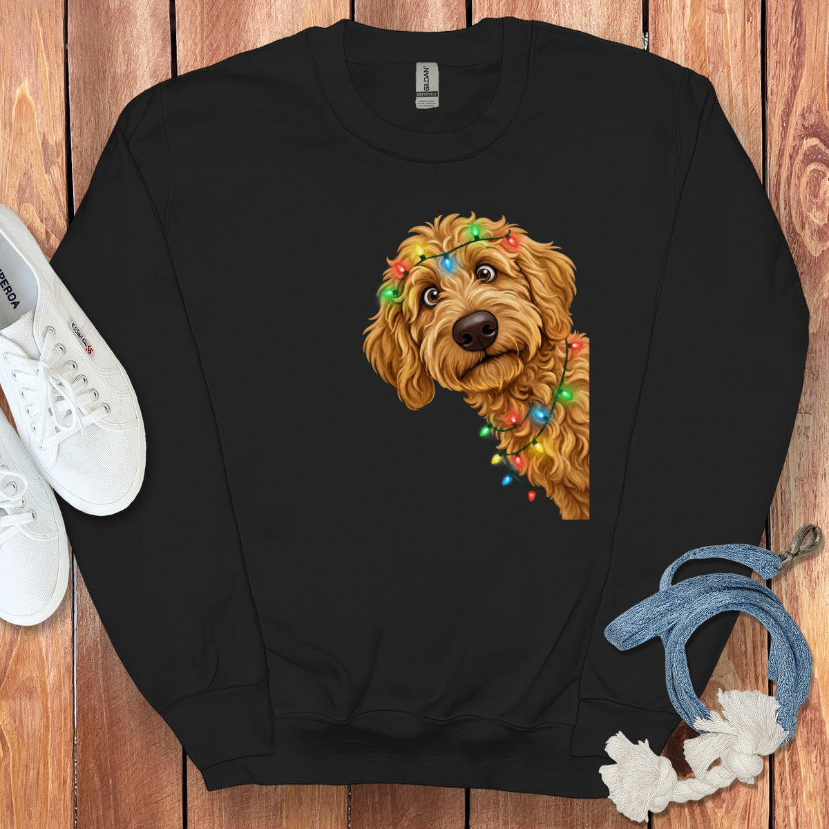 Black sweatshirt with a cartoon dog wearing colorful Christmas lights.