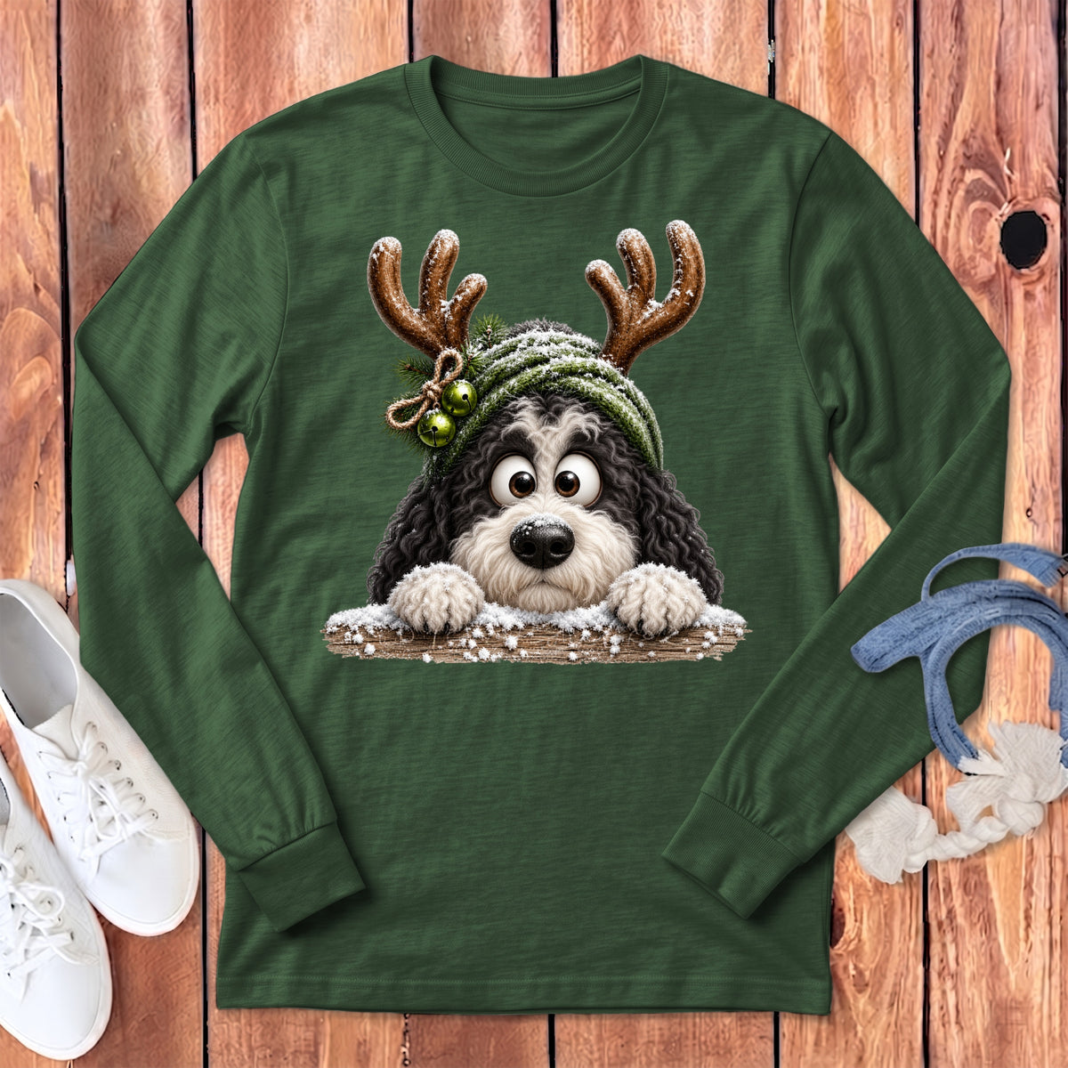 Green long-sleeve shirt with a cartoon dog wearing reindeer antlers and a Santa hat.