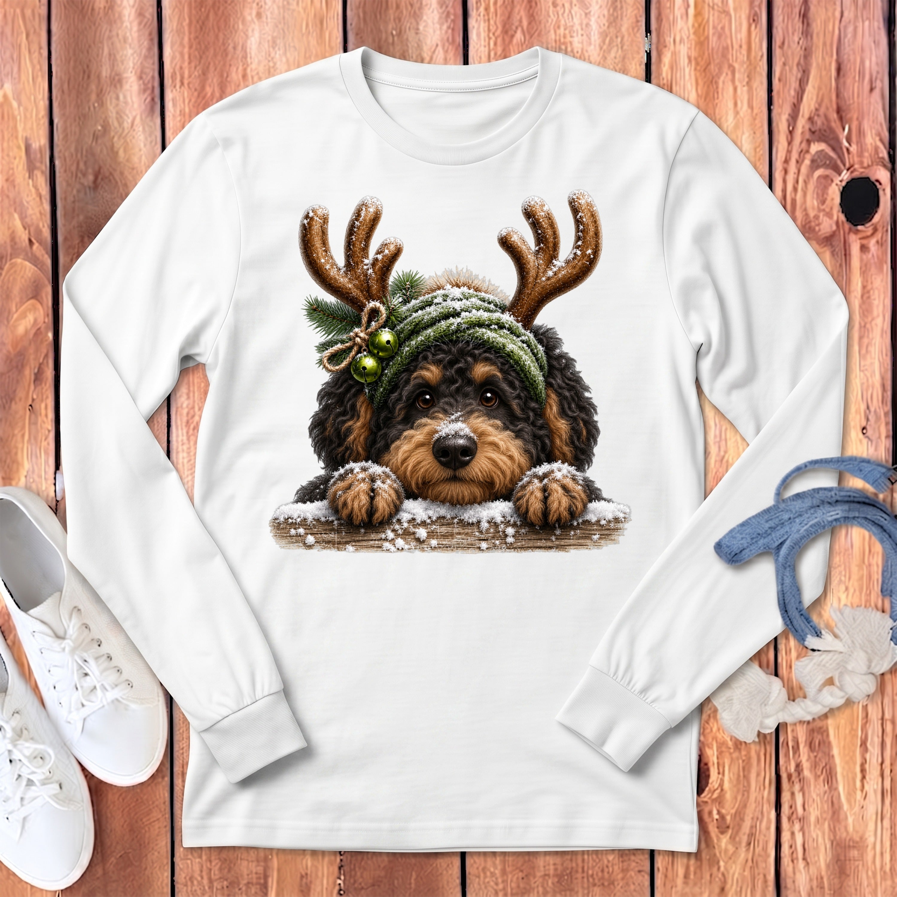 Dog wearing reindeer antlers and green beanie with snow.