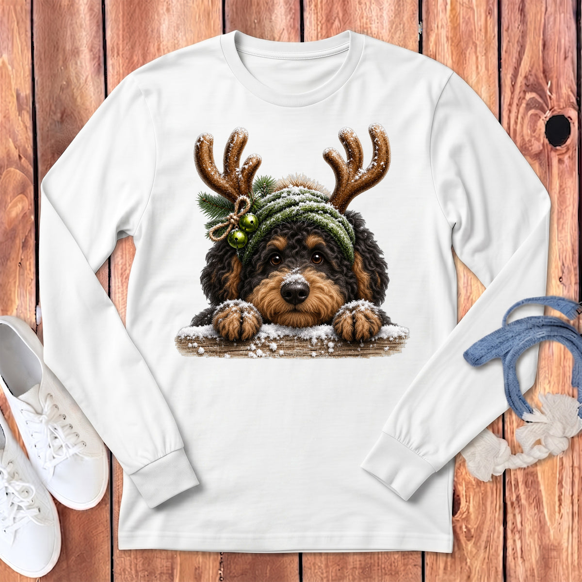 Dog wearing reindeer antlers and green beanie with snow.