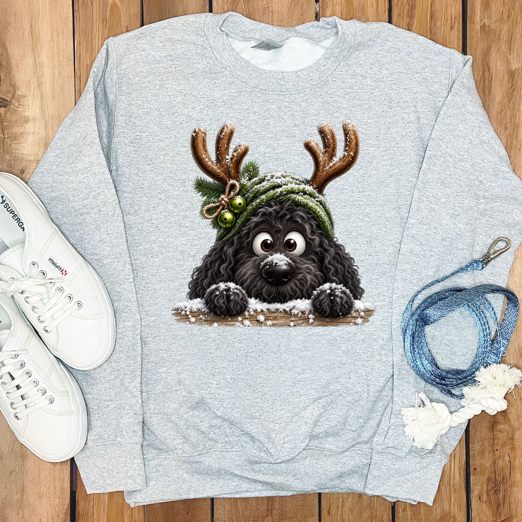 Gray sweatshirt with a cartoon black dog wearing reindeer antlers and a green beanie.