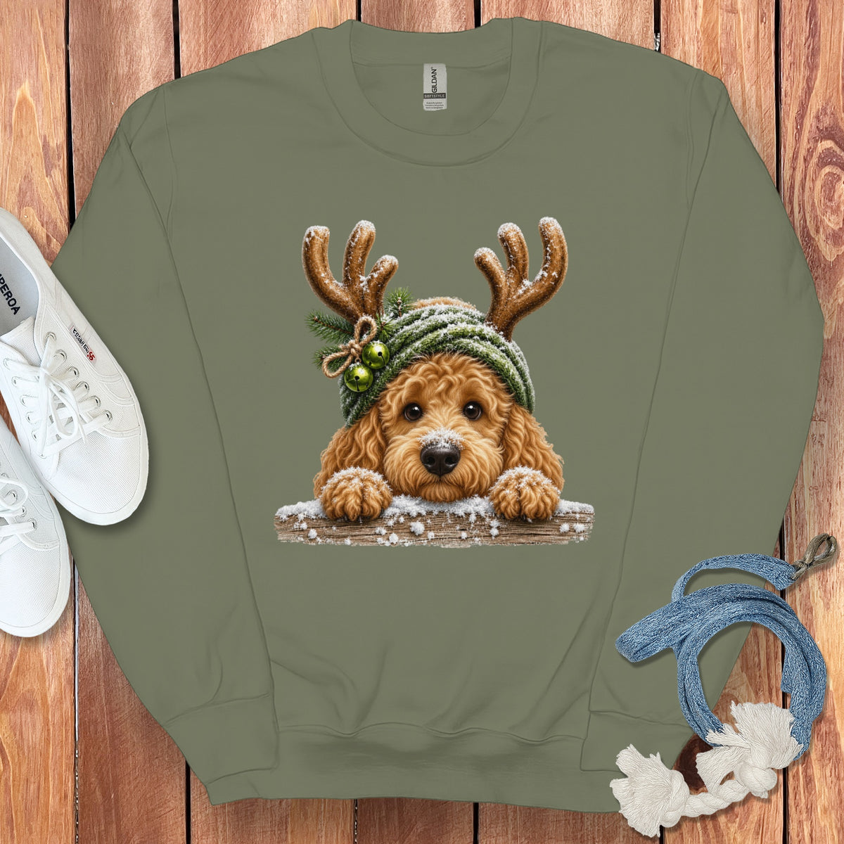 Crewneck sweatshirt with a doodle dog wearing reindeer antlers and a beanie.