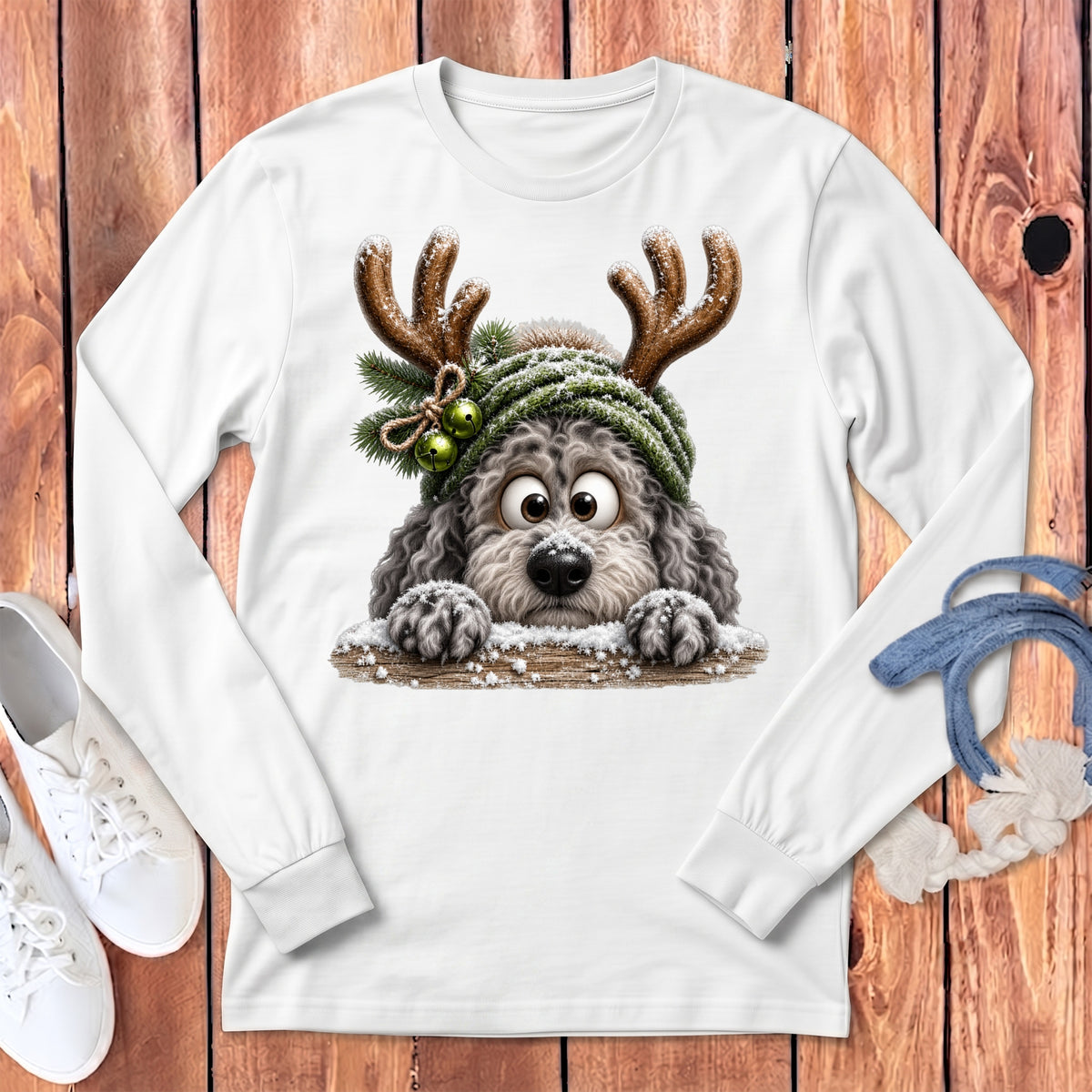 White long-sleeve shirt with a cartoon dog wearing reindeer antlers and a beanie.