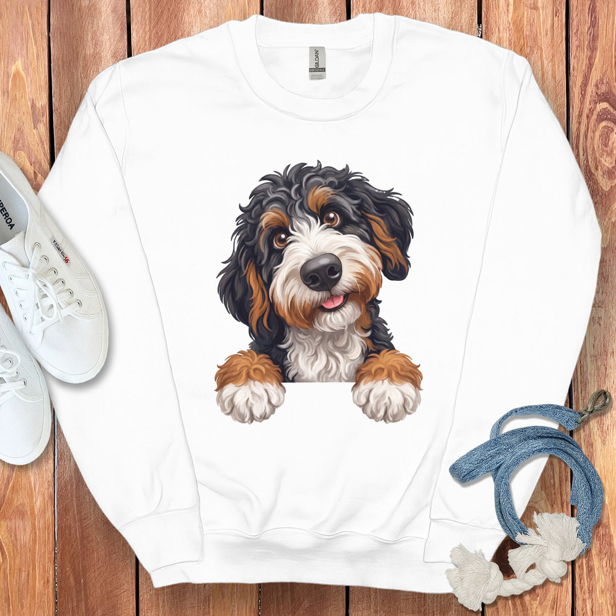 White sweatshirt with a Bernese Mountain Dog puppy illustration and a tag that reads "GILDAN SOFTSTYLE".