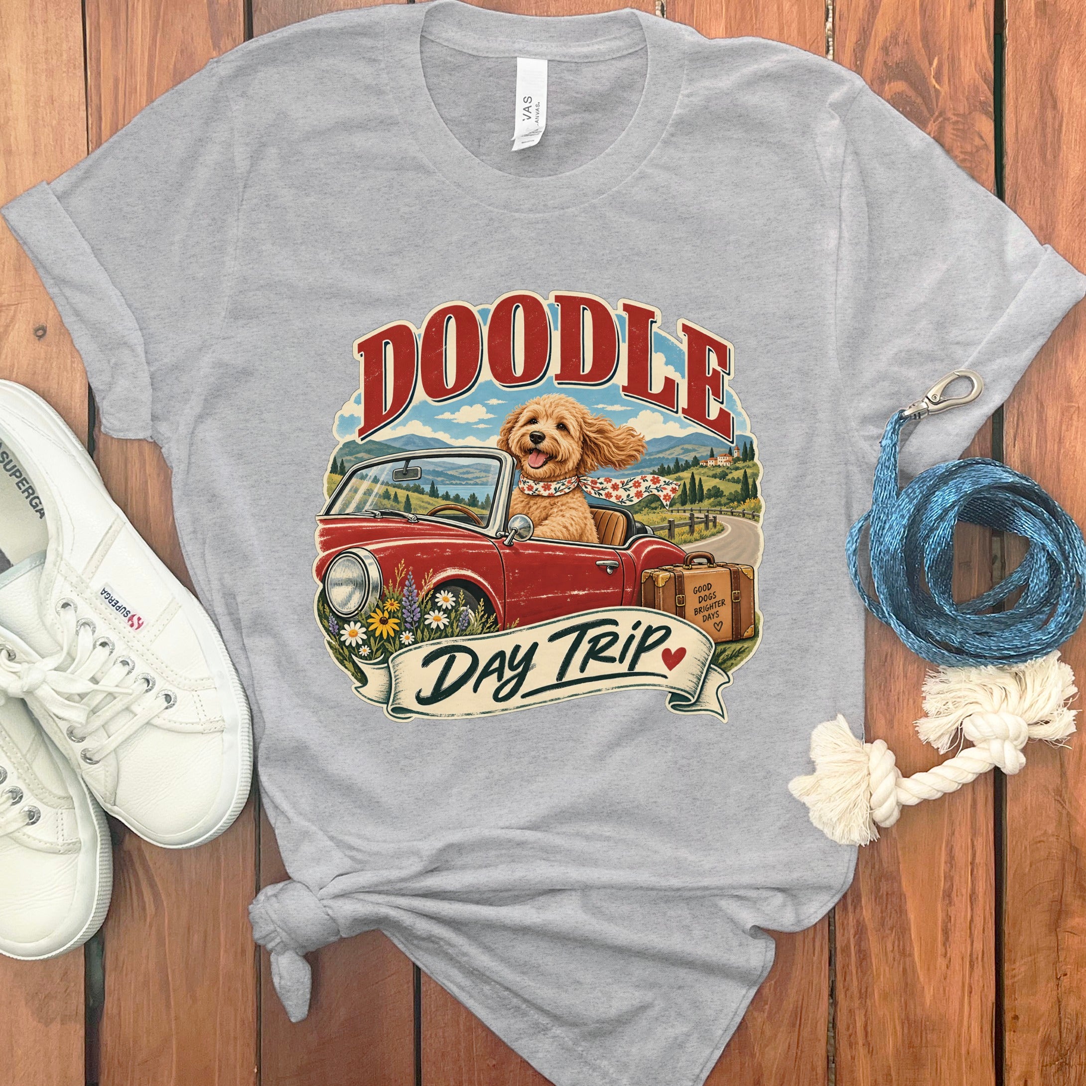 Grey t-shirt with "Doodle Day Trip" graphic of a dog in a convertible.