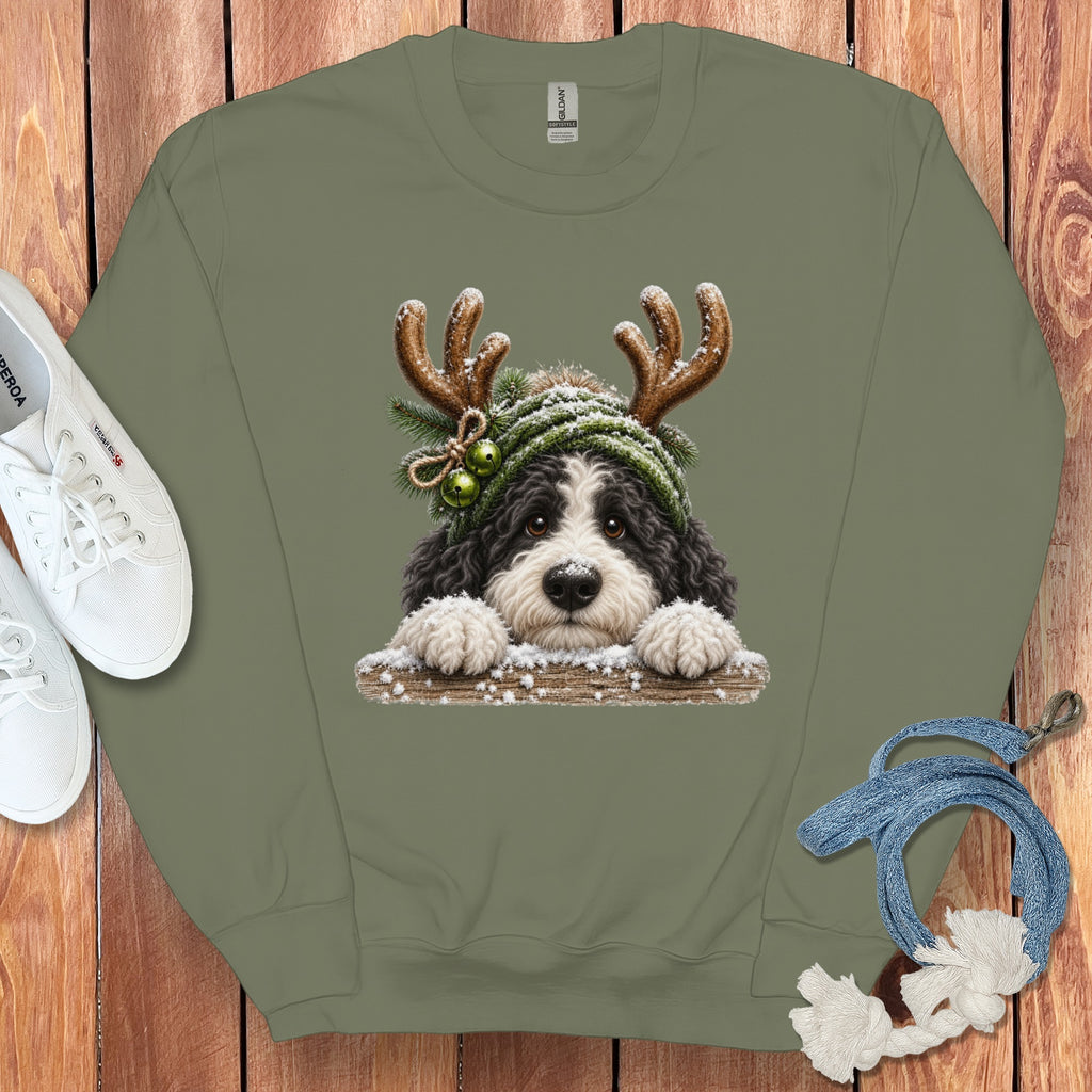 Green sweatshirt with a Christmas-themed dog graphic wearing reindeer antlers and a hat.