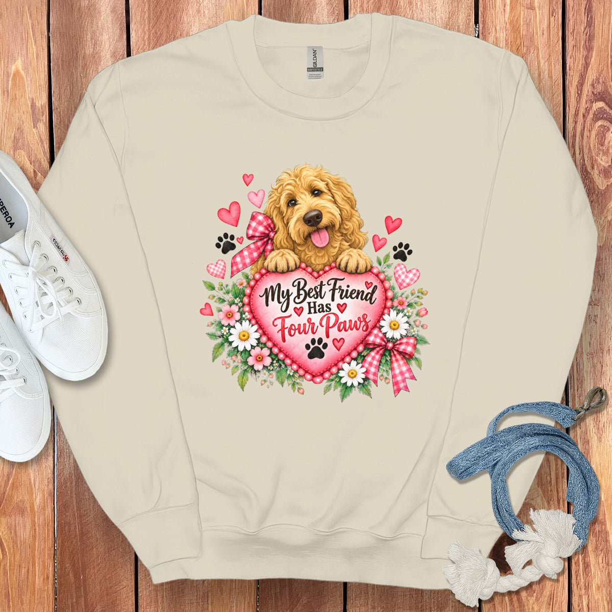 Beige crewneck sweatshirt with a golden retriever graphic, hearts, flowers, and the text My Best Friend Has Four Paws.