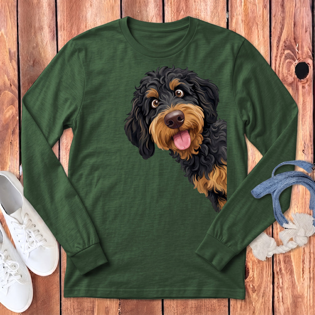 Long sleeve green shirt with a curious doodle dog graphic peeking from the side.