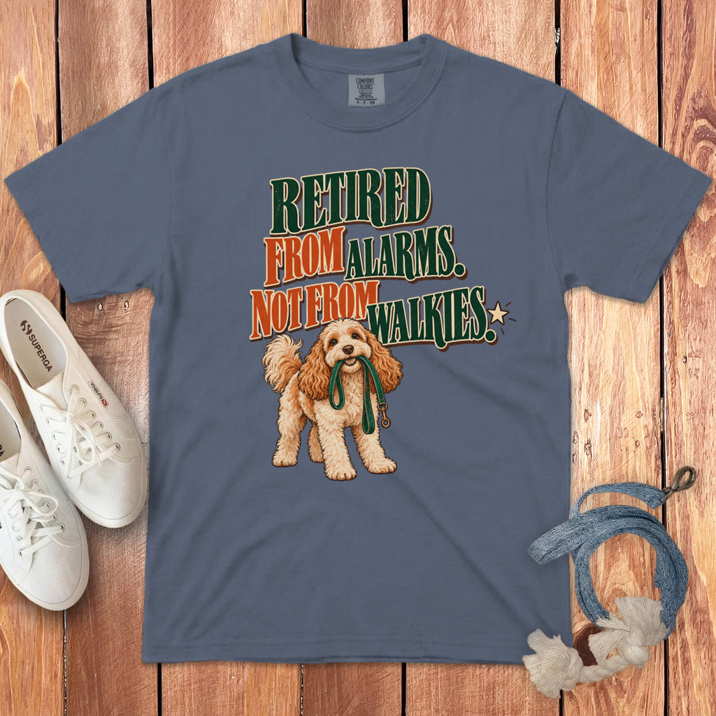 Blue t-shirt featuring a doodle dog holding a leash and the text Retired from alarms, not from walkies.