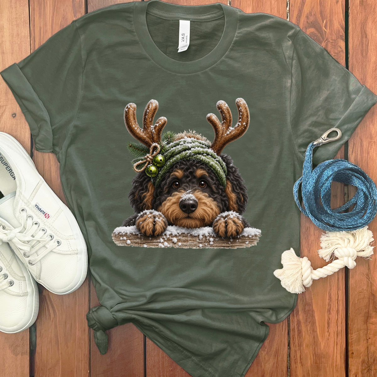 Green t-shirt with a Christmas-themed Bernedoodle dog graphic.