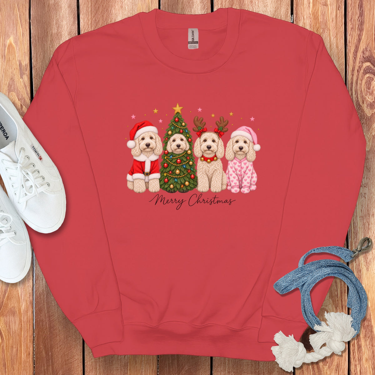 Red crewneck sweatshirt featuring a graphic of four doodle dogs celebrating Christmas and the text Merry Christmas.