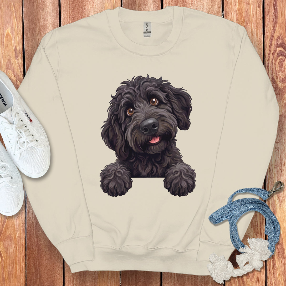Cream sweatshirt with a black doodle dog illustration.