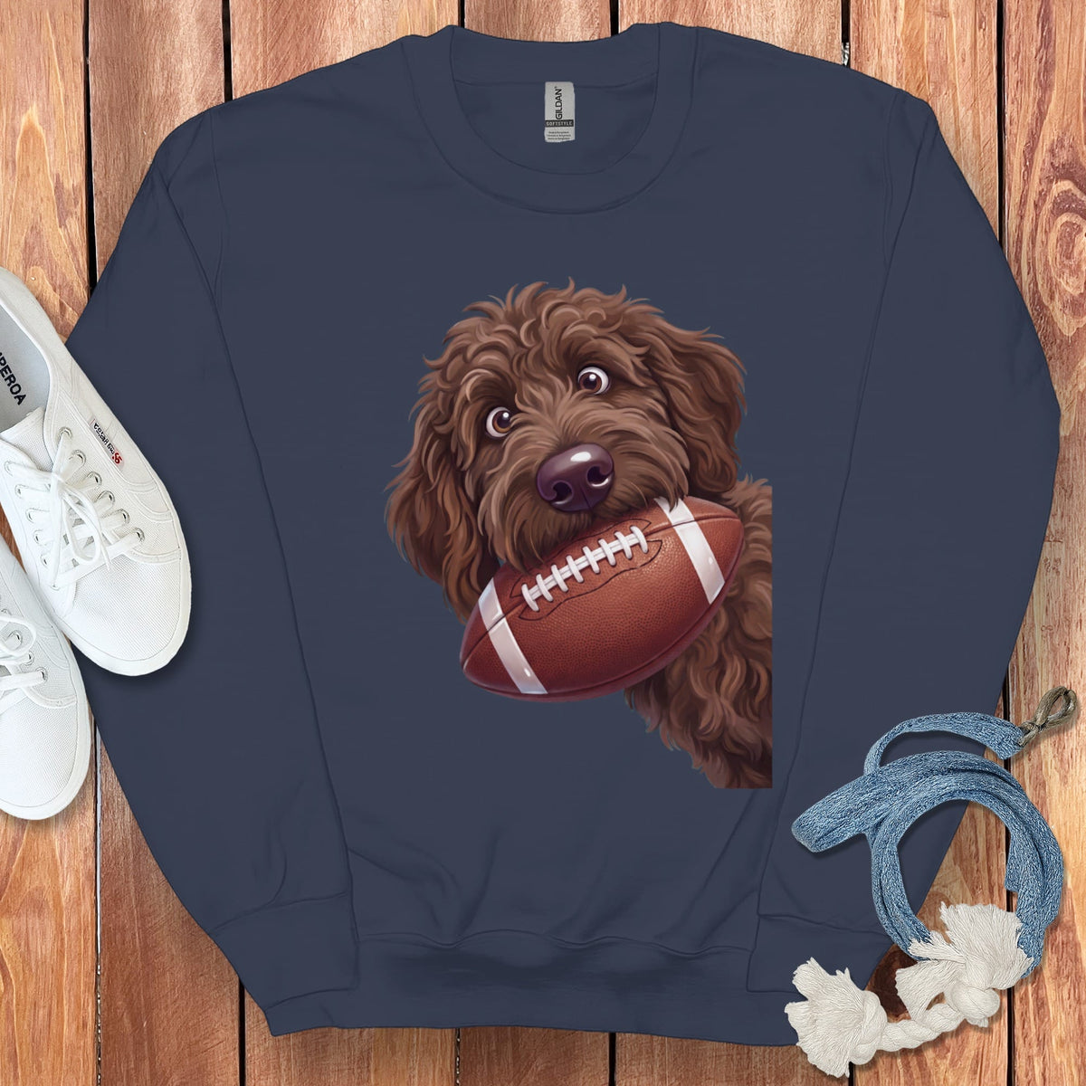 Navy sweatshirt with cartoon doodle dog holding a football