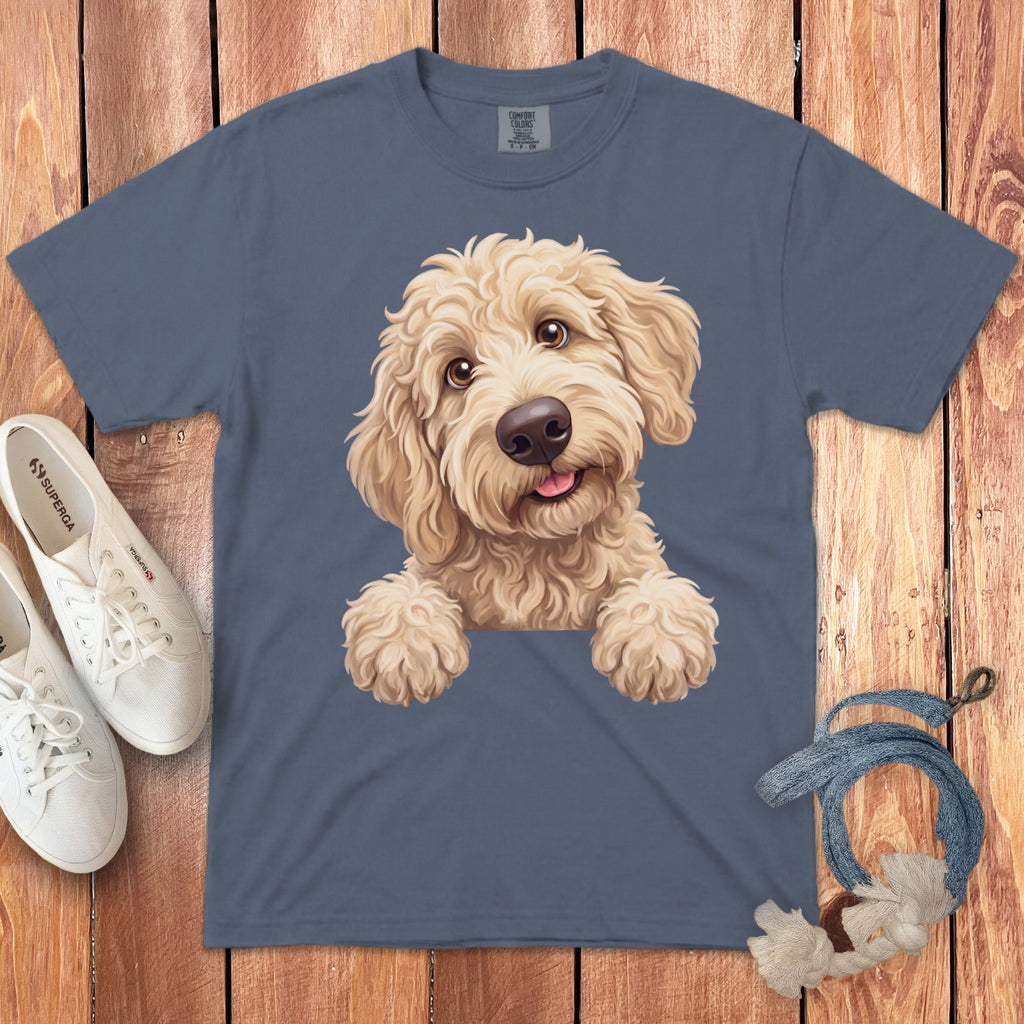 T-shirt with a painted fluffy golden dog peeking over the top.