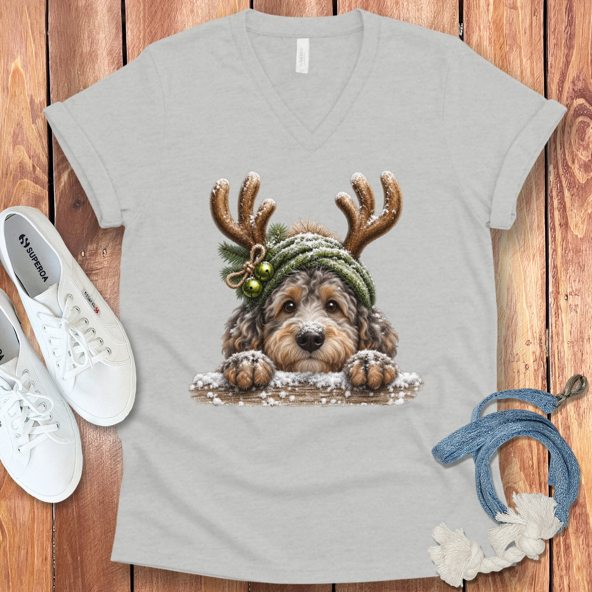 Light grey v-neck t-shirt with a doodle dog wearing antlers and a beanie.