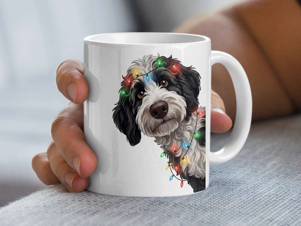 Mug with a black and white dog wearing colorful Christmas lights.