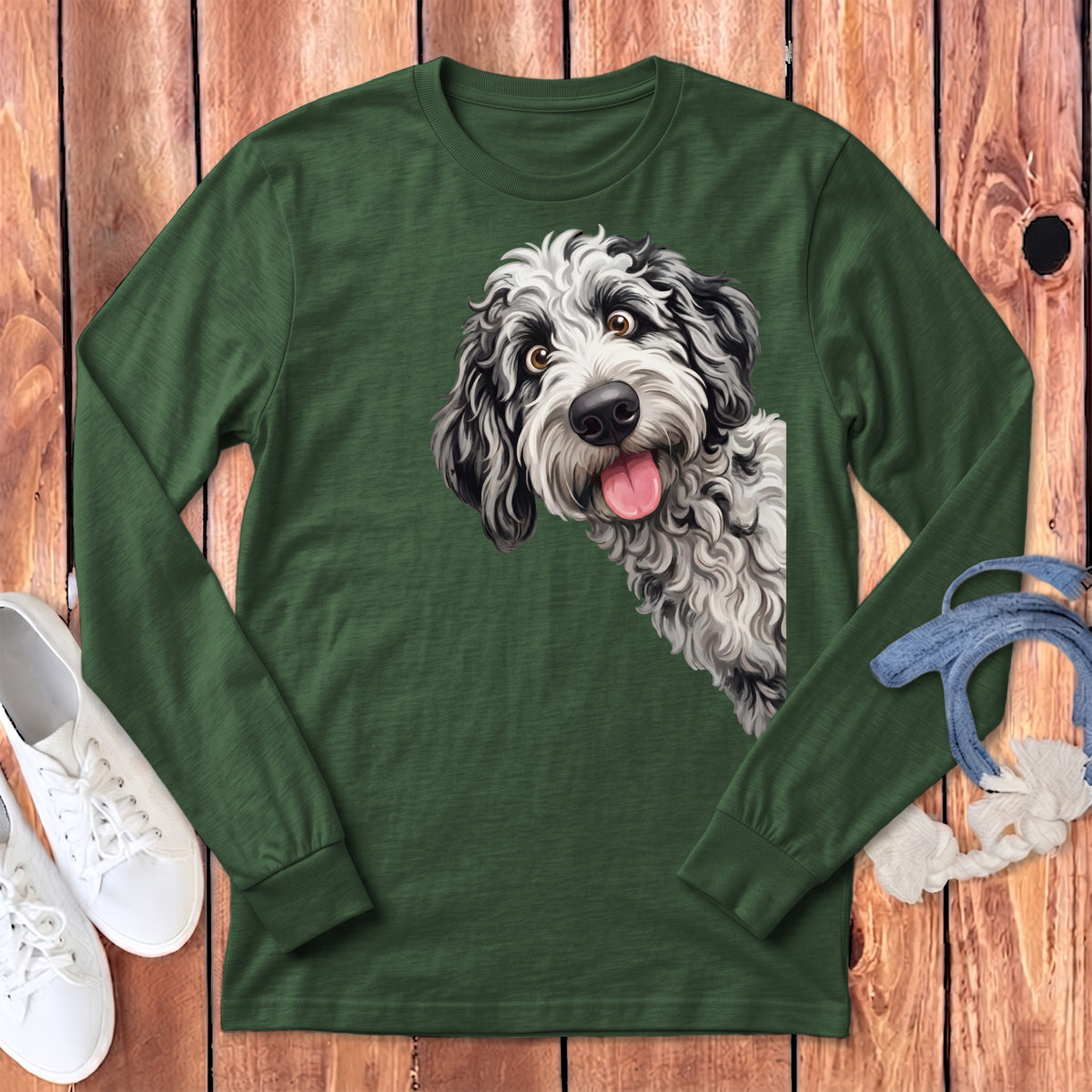 Green long sleeve shirt featuring a black and white doodle dog illustration on the left chest.