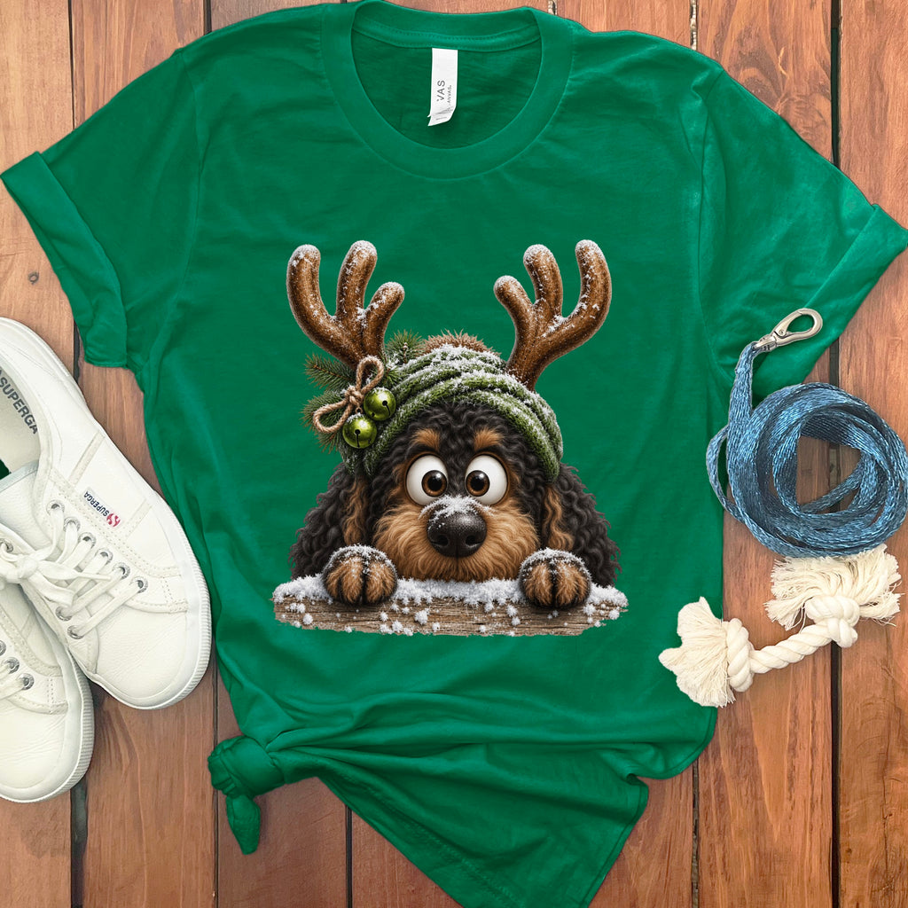 Green t-shirt with a cartoon dog wearing reindeer antlers and a green knit hat.