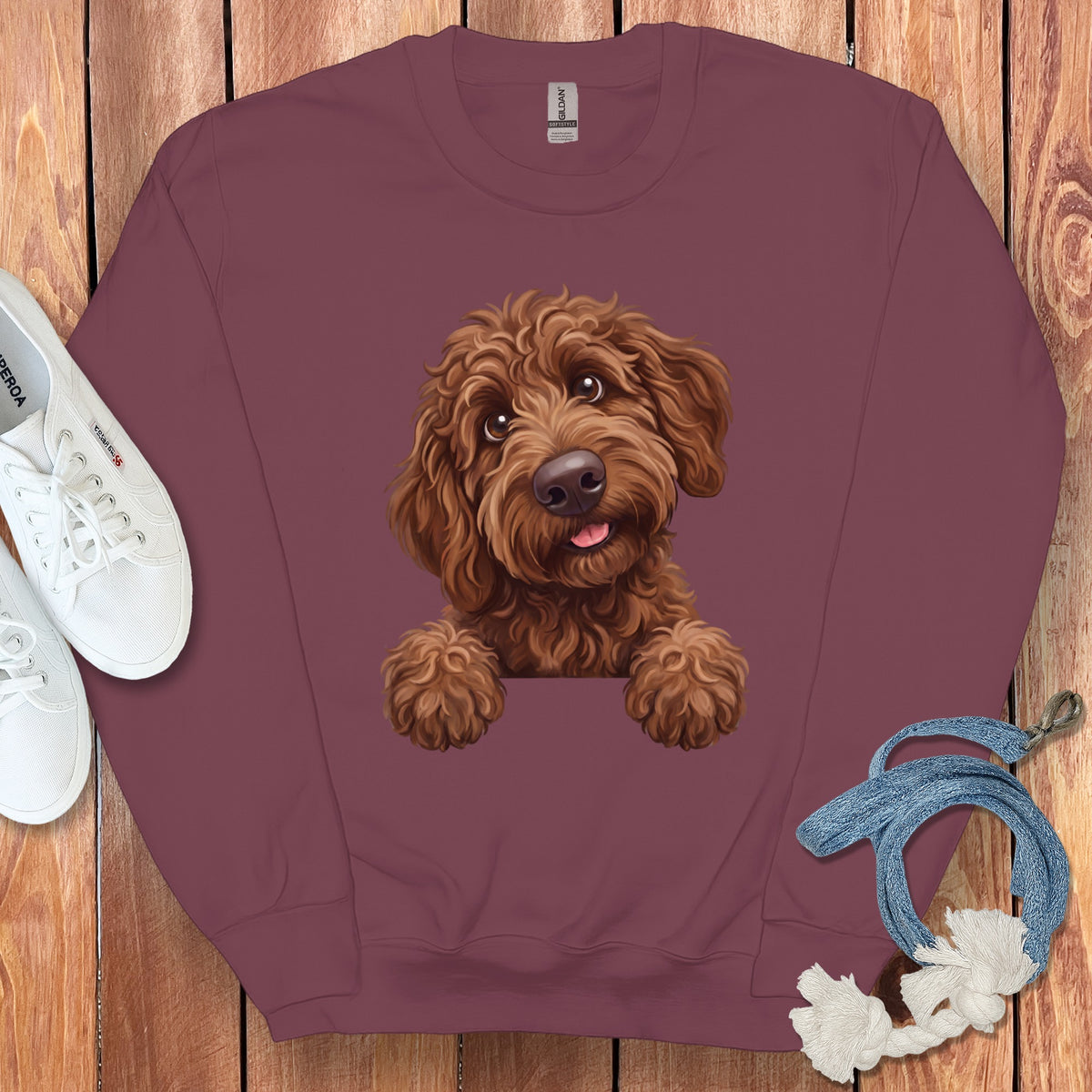 Burgundy sweatshirt with a brown dog illustration and white shoes.