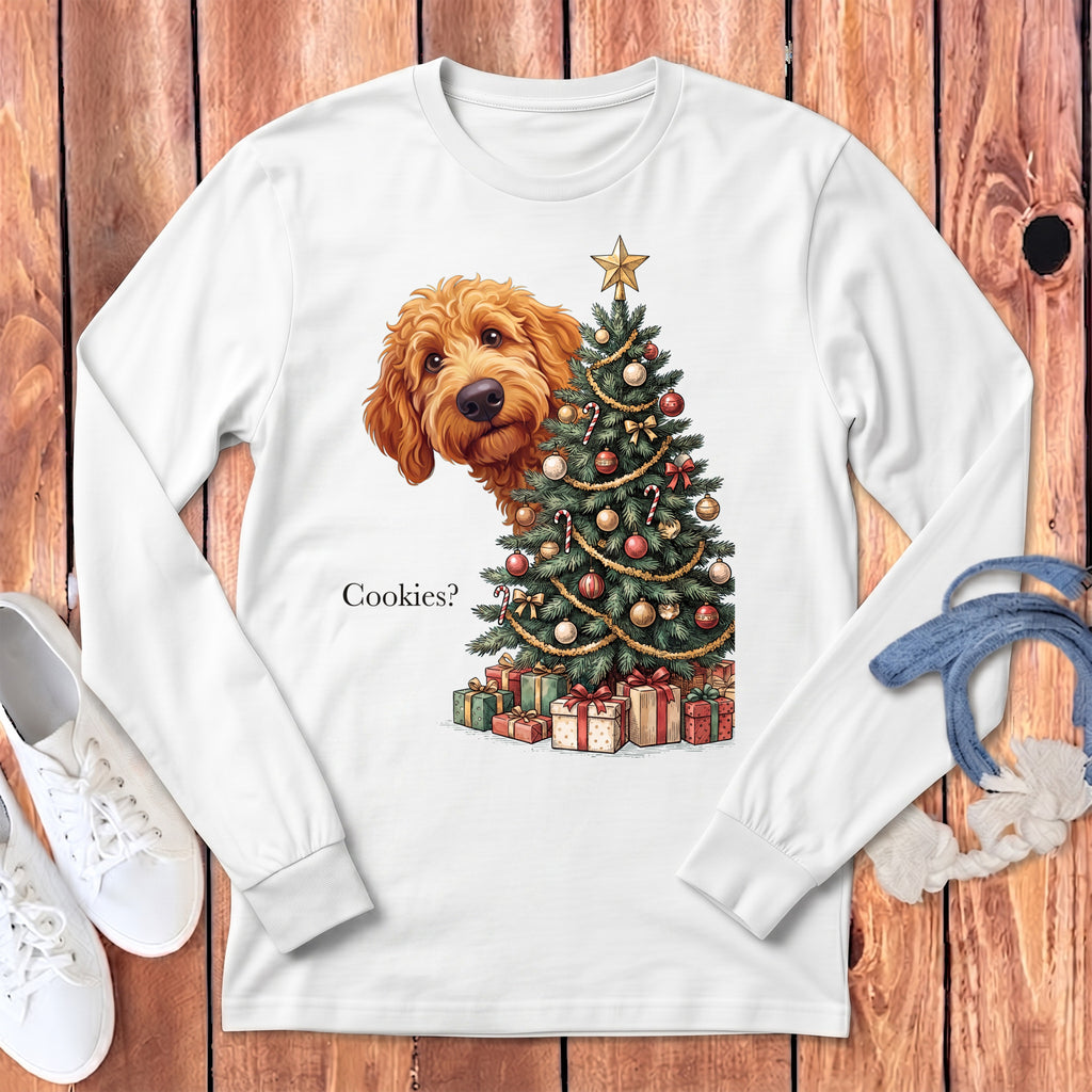 Goldendoodle peeking from behind a decorated Christmas tree and gifts, with text "Cookies?".