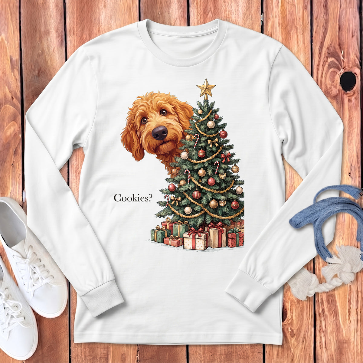 Goldendoodle peeking from behind a decorated Christmas tree and gifts, with text "Cookies?".