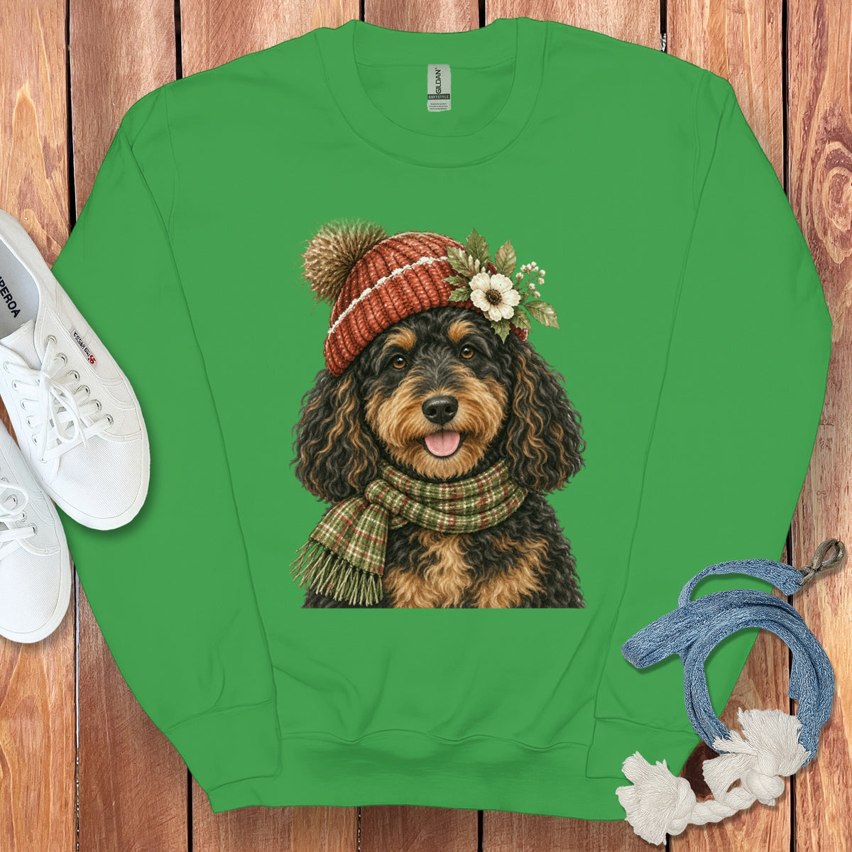 Green sweatshirt with a watercolor portrait of a dog wearing a hat and scarf.