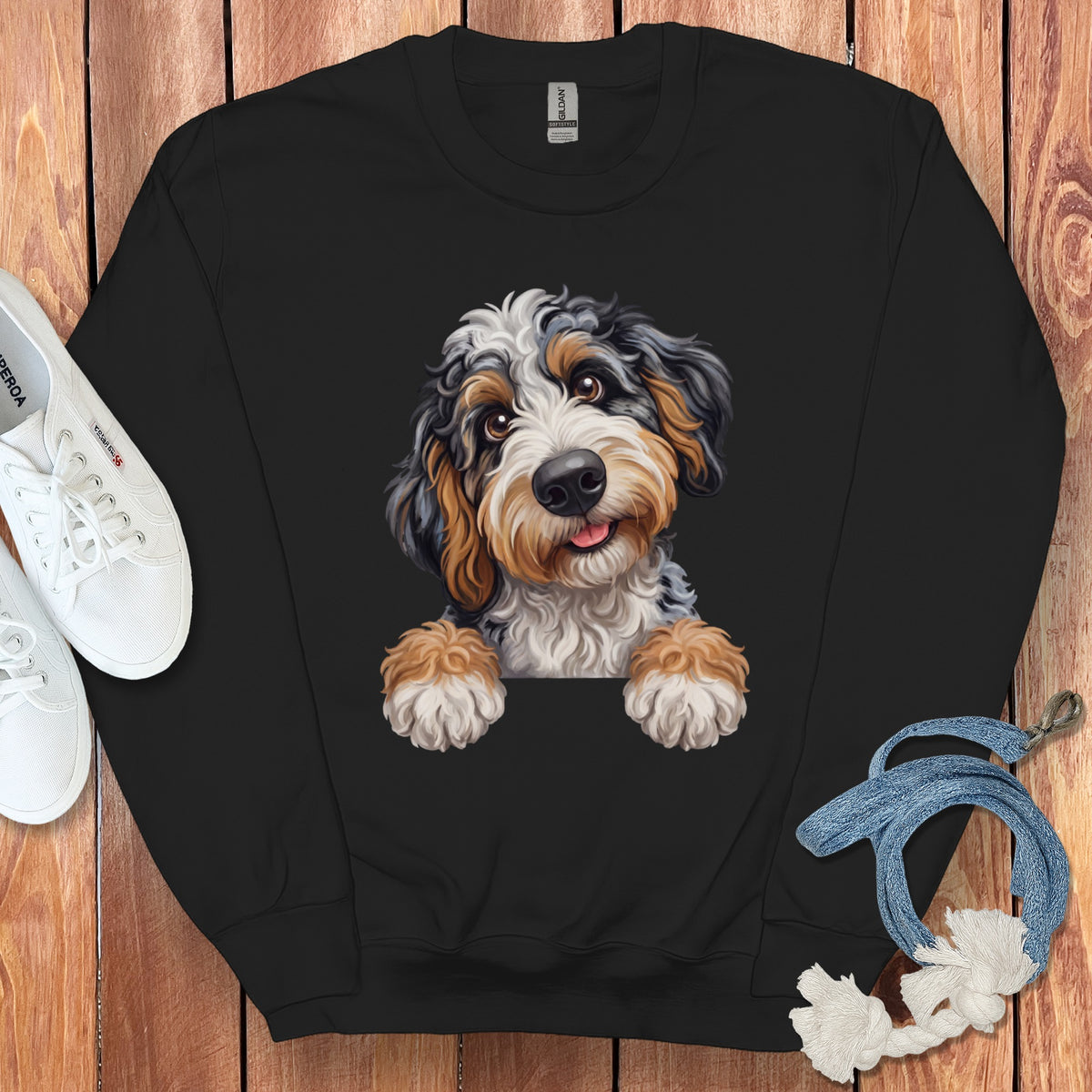 Black sweatshirt with a cartoon Bernese Mountain Dog face peeking over the collar.