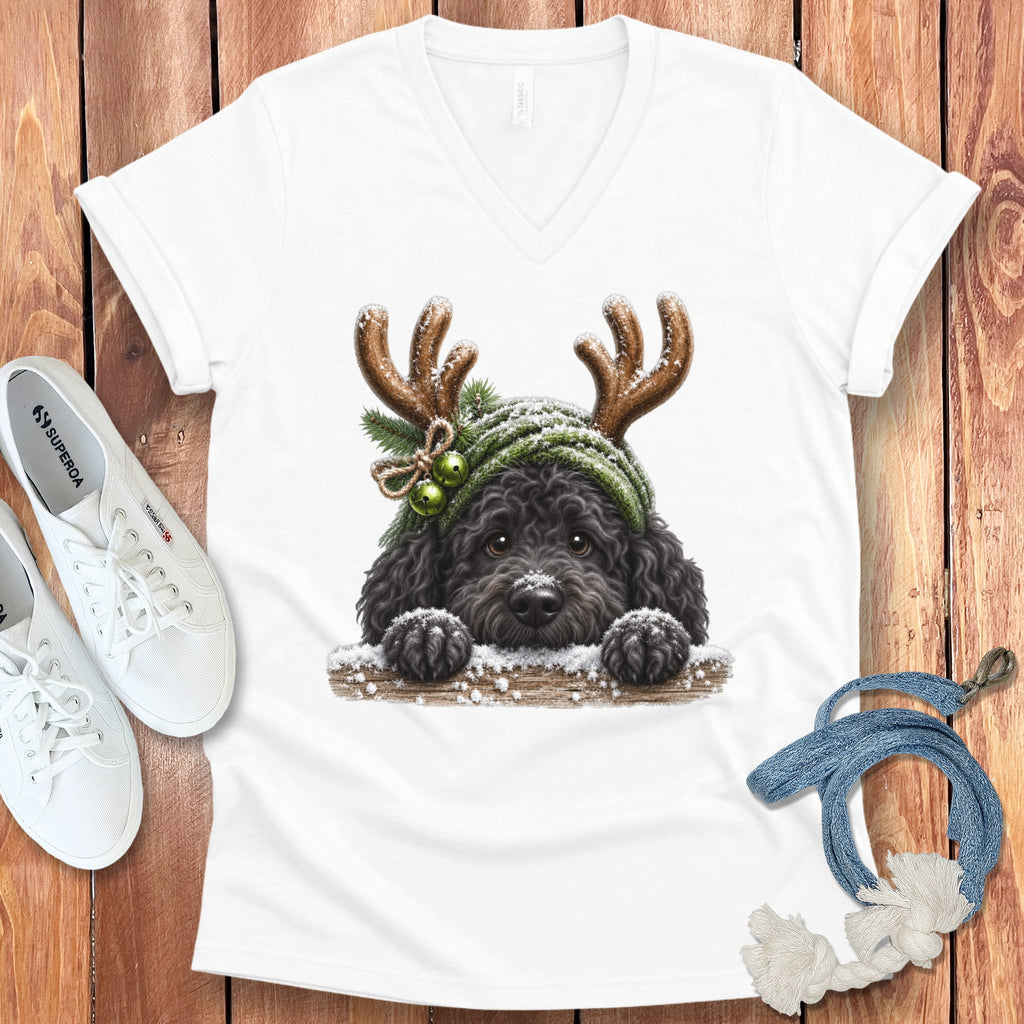 White v-neck t-shirt with a drawing of a black dog wearing reindeer antlers and a green beanie.