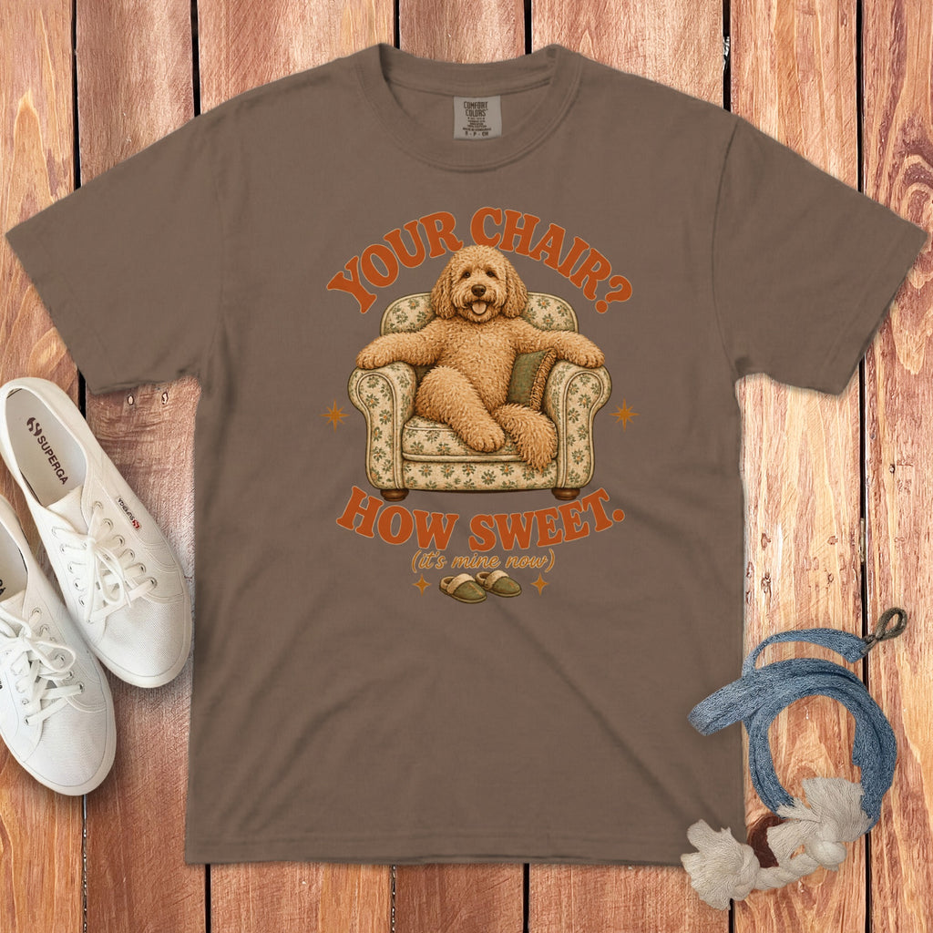 Brown t-shirt featuring a graphic of a fluffy dog sitting in an armchair with text.