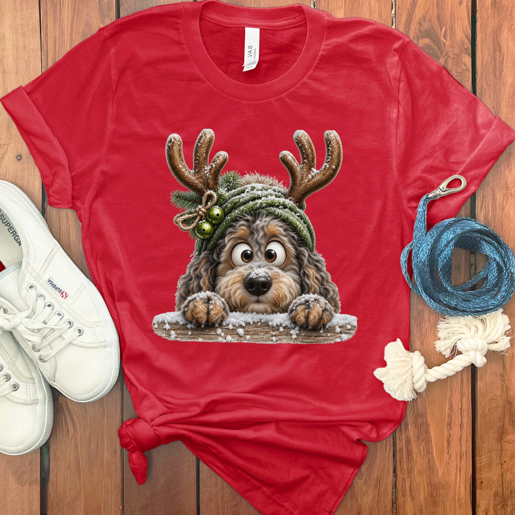 Red t-shirt with a cartoon dog wearing antlers and a green hat.