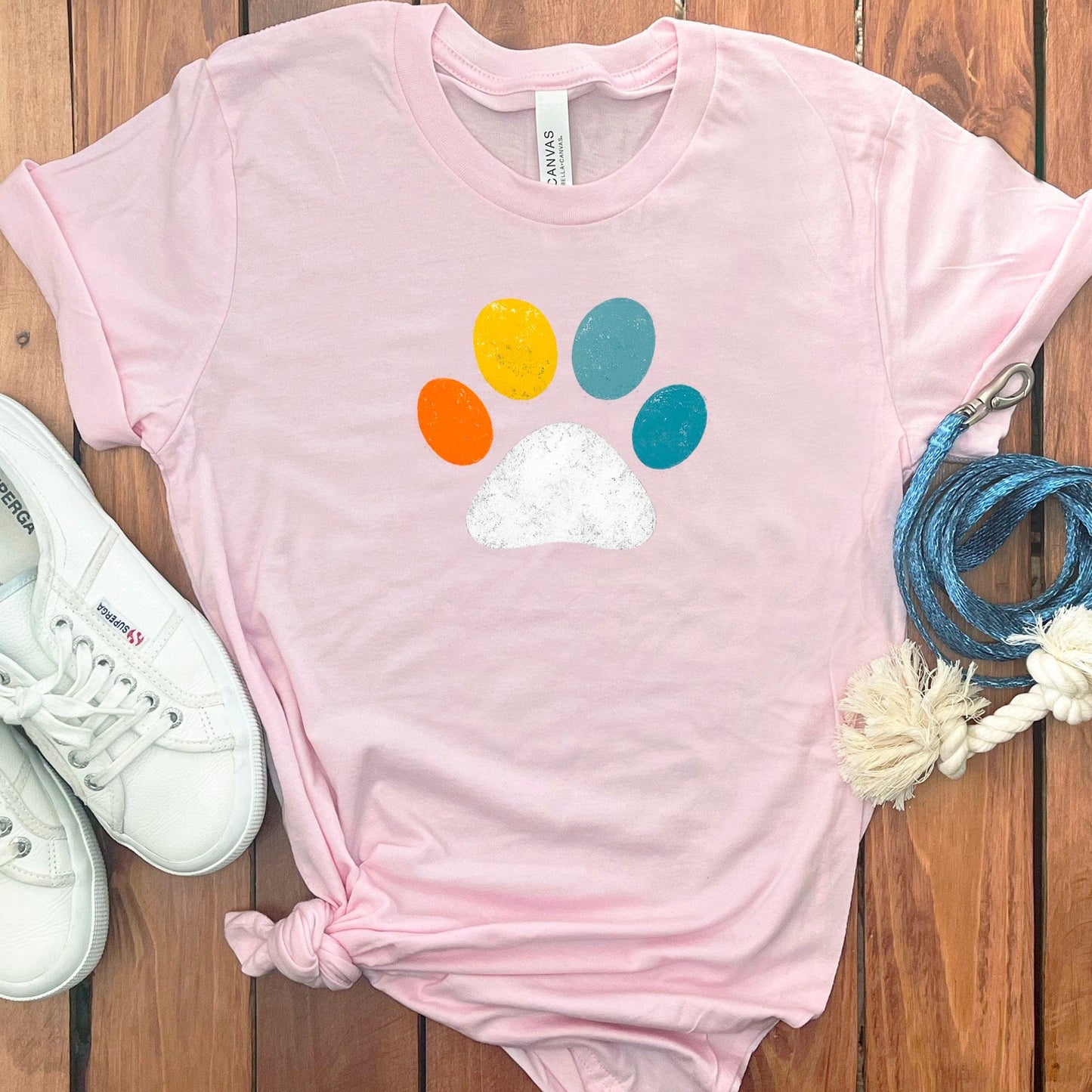 Colorful Paw Print Design on Light Pink T-Shirt product