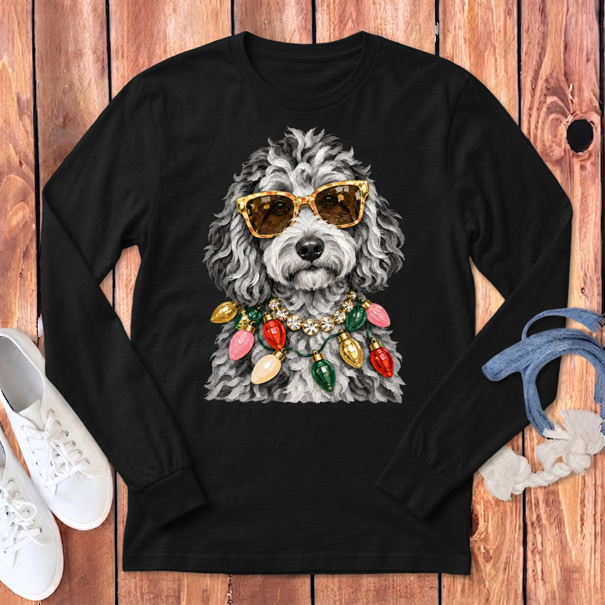 Black long-sleeve shirt with a poodle wearing sunglasses and a Christmas light necklace.