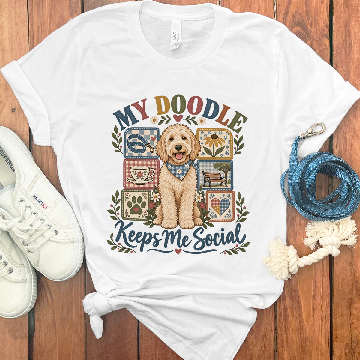 White t-shirt with "My Doodle Keeps Me Social" and a doodle dog surrounded by checkered squares.