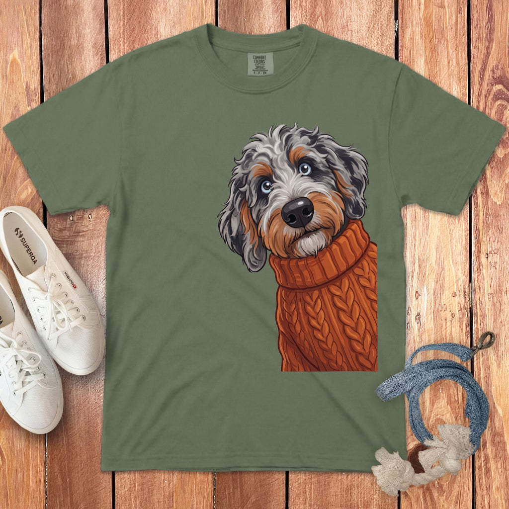 Olive green t-shirt with a cartoon dog wearing an orange sweater.