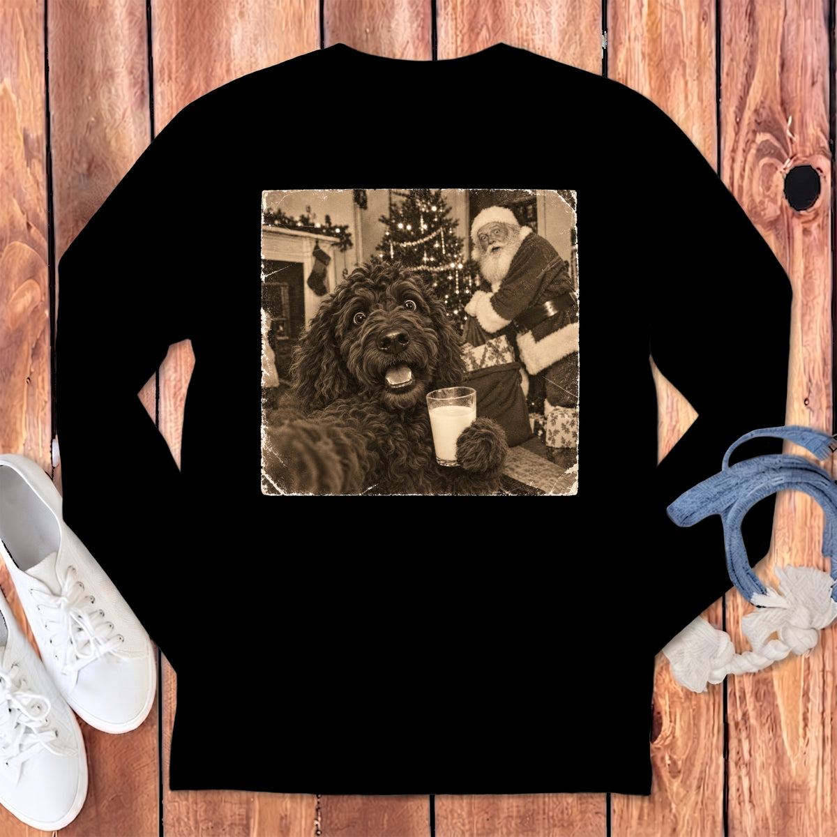 Black long-sleeved shirt with a vintage graphic on the chest showing a curly dog holding a glass of milk near Santa Claus.
